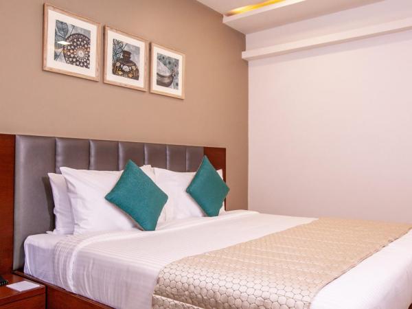 Mango Suites Viera : photo 5 de la chambre chambre double ou lits jumeaux