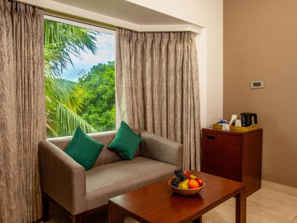 Mango Suites Viera : photo 6 de la chambre chambre double ou lits jumeaux