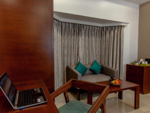 Mango Suites Viera : photo 7 de la chambre chambre double ou lits jumeaux