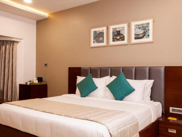 Mango Suites Viera : photo 8 de la chambre chambre double ou lits jumeaux