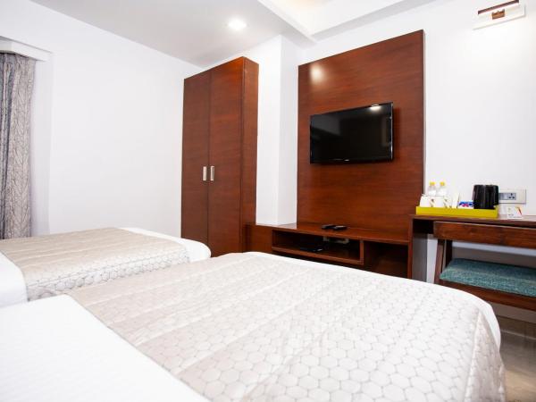 Mango Suites Viera : photo 1 de la chambre chambre deluxe double ou lits jumeaux