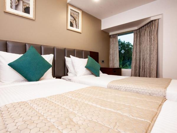 Mango Suites Viera : photo 3 de la chambre chambre deluxe double ou lits jumeaux