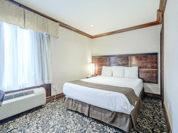 Woodbine Hotel & Suites : photo 1 de la chambre chambre lit queen-size