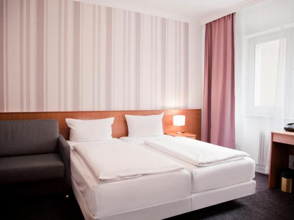 Les Nations : photo 5 de la chambre chambre double deluxe avec lit d'appoint