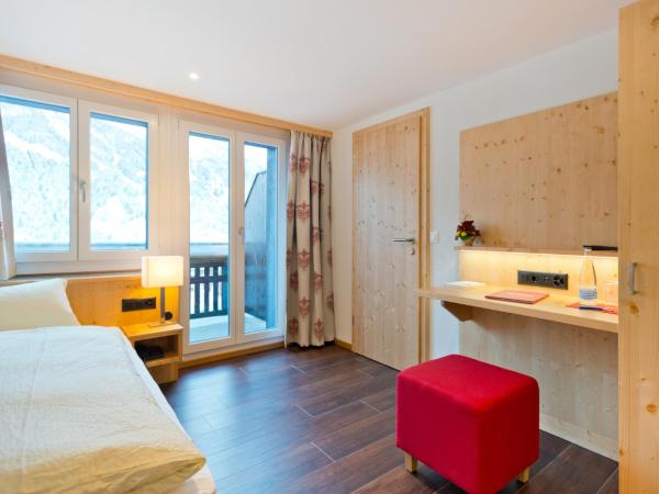 Hotel Caprice - Grindelwald : photo 1 de la chambre hébergement simple confort