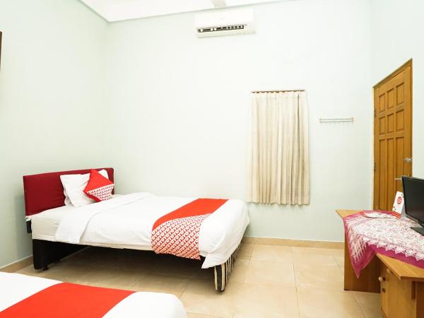 Kartika Syariah Homestay by Stayku : photo 3 de la chambre chambre lits jumeaux standard