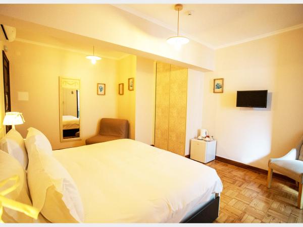 Senhor Gigi : photo 5 de la chambre chambre double ou lits jumeaux deluxe – vue sur jardin