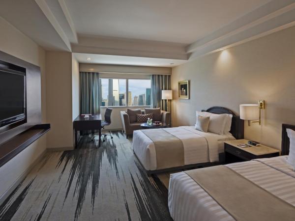 Gran Melia Jakarta : photo 7 de la chambre chambre deluxe