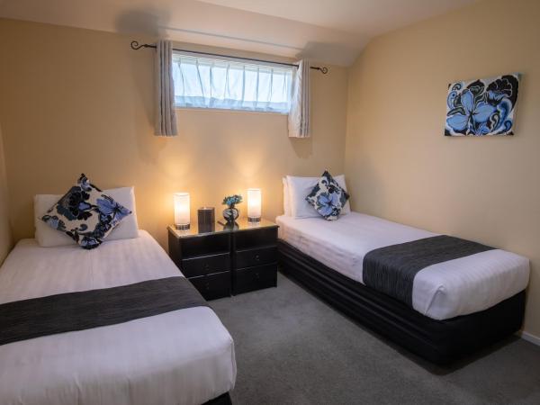 ASURE Abbella Lodge Motel : photo 6 de la chambre appartement 2 chambres avec baignoire spa