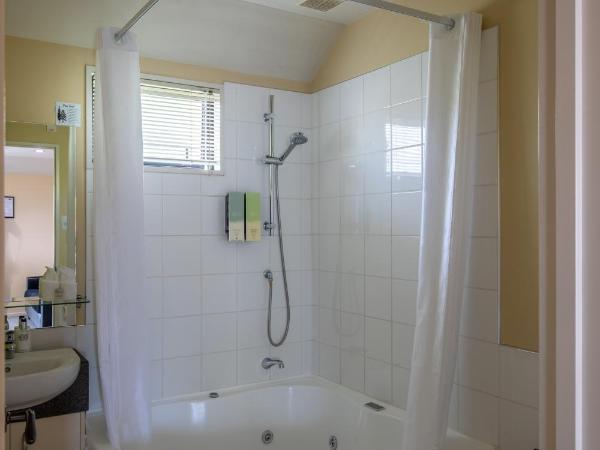 ASURE Abbella Lodge Motel : photo 9 de la chambre appartement 1 chambre avec baignoire spa