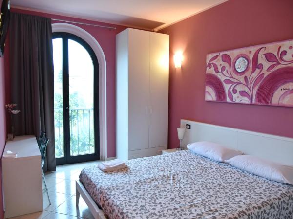 Agriturismo Argaland : photo 3 de la chambre chambre double ou lits jumeaux - vue sur jardin
