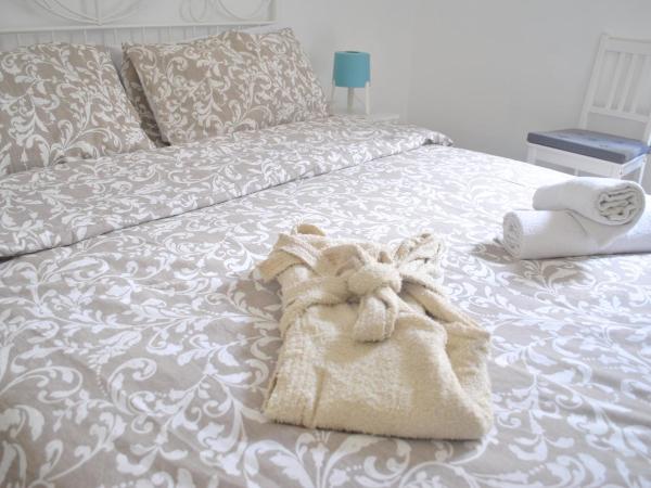 Sunrise Hostel & Rooms : photo 6 de la chambre chambre quadruple avec salle de bains commune