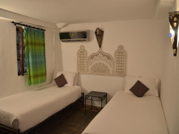 Riad Jamaï : photo 2 de la chambre chambre lits jumeaux anis