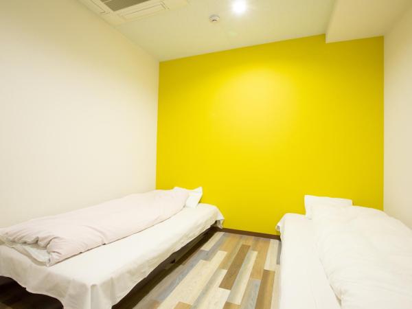 123 Guesthouse : photo 1 de la chambre twin room with shared bathroom - f