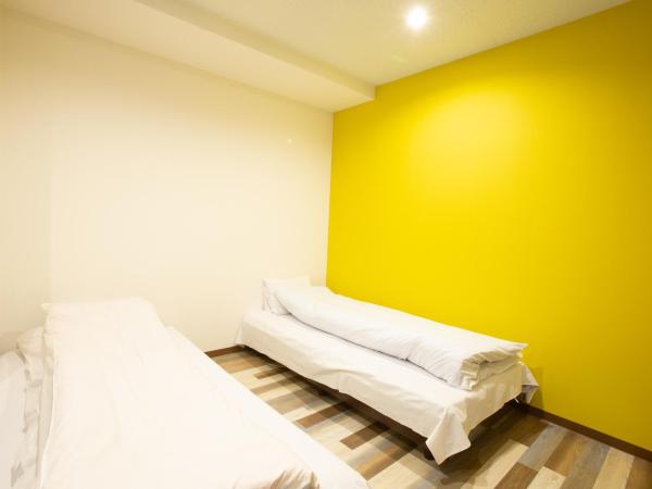 123 Guesthouse : photo 7 de la chambre chambre triple - vue sur ville