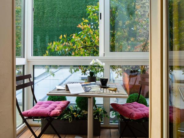 Hôtel de la Tour Eiffel : photo 2 de la chambre chambre quadruple avec terrasse