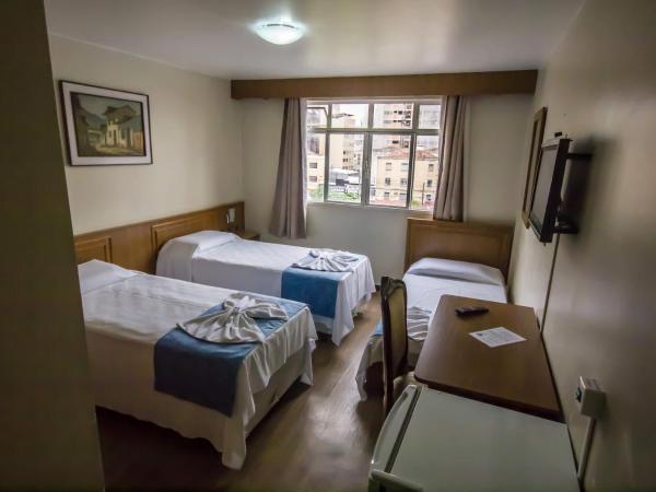 Estrela do Sul Hotel : photo 1 de la chambre chambre triple standard avec 3 lits simples