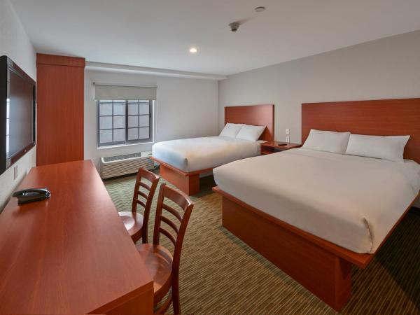 Extended Suites Monterrey Aeropuerto : photo 4 de la chambre suite avec 2 lits queen-size