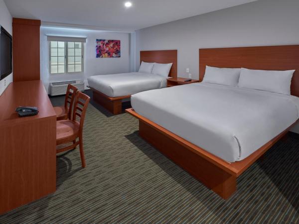 Extended Suites Monterrey Aeropuerto : photo 1 de la chambre suite avec 2 lits queen-size