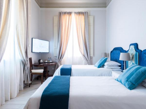 Villa Savioli Room & Breakfast : photo 1 de la chambre chambre double ou lits jumeaux avec salle de bains privative externe