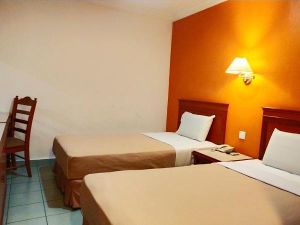Megah Inn : photo 3 de la chambre chambre lits jumeaux standard
