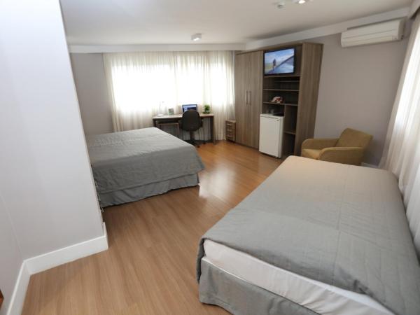 Hotel Trianon Paulista : photo 1 de la chambre chambre triple avec 1 lit double et 1 lit simple