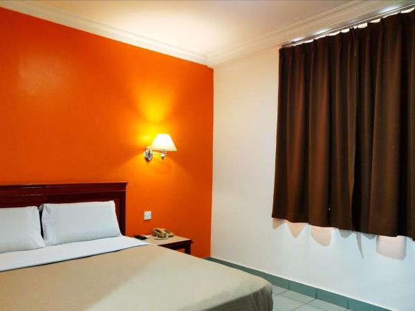 Megah Inn : photo 2 de la chambre chambre lit queen-size deluxe