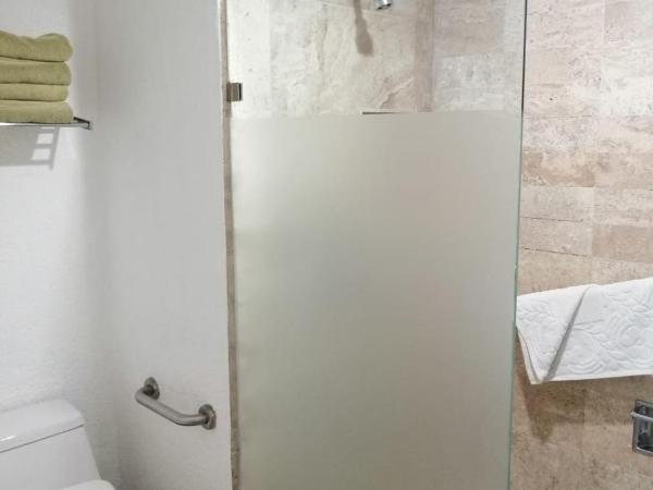 Beachfront Getaway Condo : photo 4 de la chambre appartement - vue sur jardin