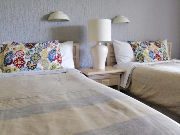 Beachfront Getaway Condo : photo 7 de la chambre appartement - vue sur jardin