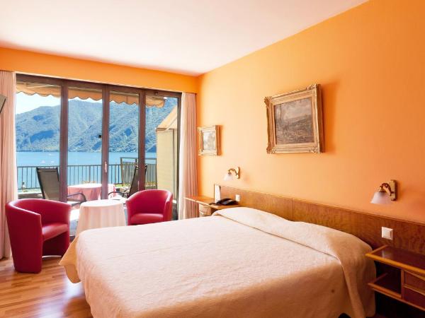Swiss Lodge Nassa Garni : photo 6 de la chambre chambre double supérieure avec terrasse et vue sur le lac

