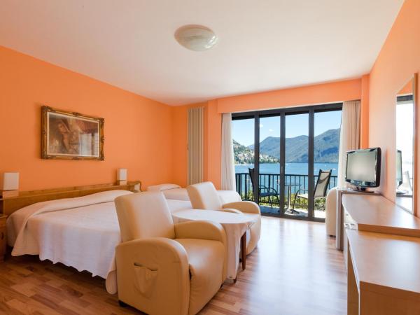 Swiss Lodge Nassa Garni : photo 10 de la chambre chambre triple standard avec balcon - vue sur lac