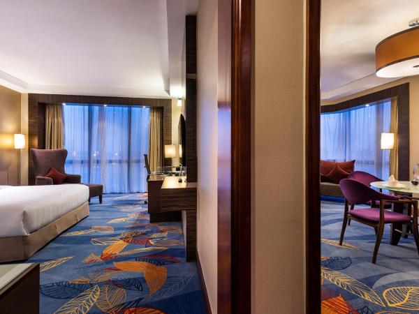 Novotel Beijing Peace : photo 2 de la chambre suite lit king-size premier