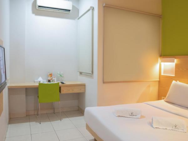 LeGreen Suite Senayan : photo 2 de la chambre chambre double supérieure