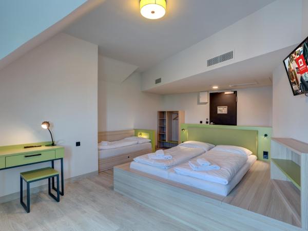 MEININGER Hotel München Olympiapark : photo 2 de la chambre chambre triple