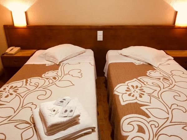 Hotel Portinari : photo 3 de la chambre chambre lits jumeaux