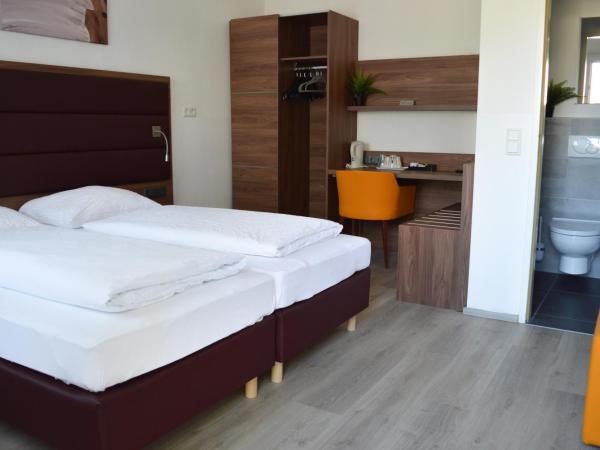 Pension Elisabeth - Rooms & Apartments : photo 1 de la chambre chambre lits jumeaux - annexe