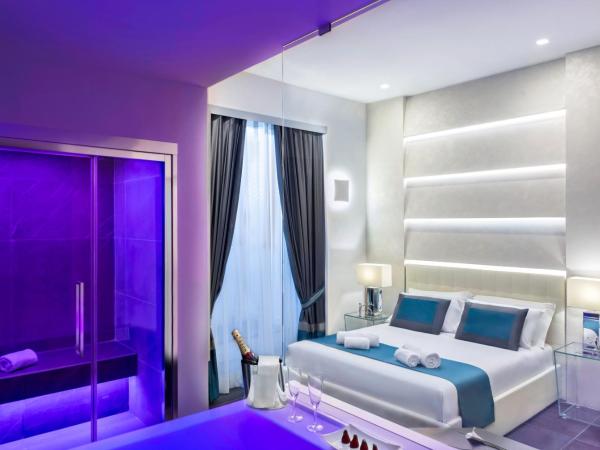 Carten : photo 1 de la chambre chambre lit king-size dépendance avec baignoire spa et sauna