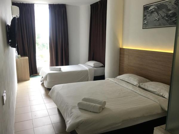 Place2Stay @ Kenyalang : photo 1 de la chambre chambre triple Économique