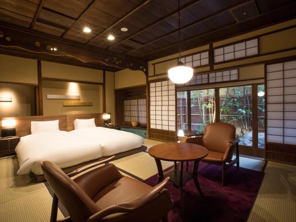 Sowaka : photo 1 de la chambre chambre lits jumeaux deluxe hollywood avec jardin privé (bâtiment principal)