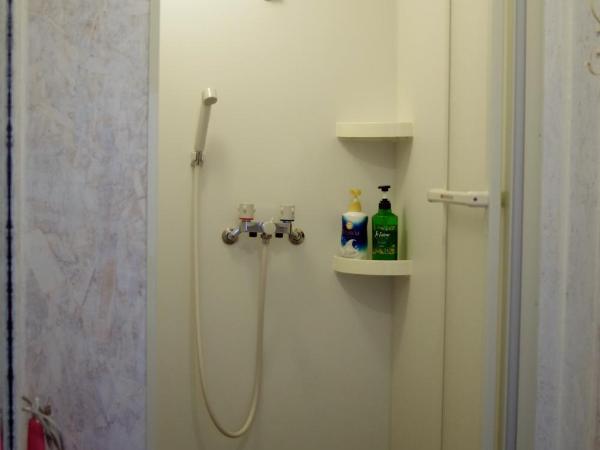 Kichinan : photo 7 de la chambre chambre quadruple avec salle de bains commune