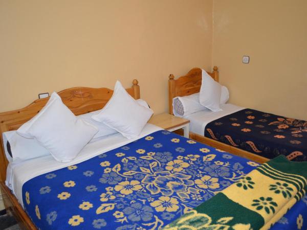 Hotel Atlas Ouarzazate : photo 1 de la chambre chambre lits jumeaux