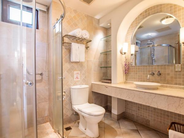 Aegean Suites Sanya Yalong Bay Resort : photo 3 de la chambre suite 2 chambres avec cuisine, ustensiles et lave-linge/sèche-linge - vue sur jardin