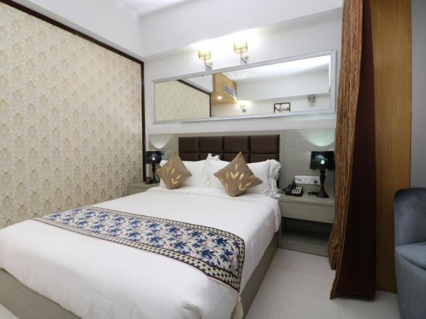 Aristocrat Hotel, New Town, Kolkata : photo 5 de la chambre chambre lit queen-size deluxe