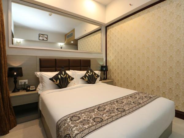 Aristocrat Hotel, New Town, Kolkata : photo 2 de la chambre chambre lit queen-size deluxe
