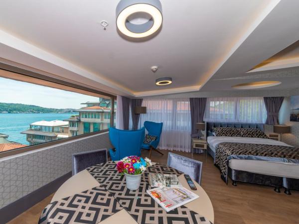 Feri Suites : photo 2 de la chambre chambre lit king-size deluxe - vue sur mer - annexe