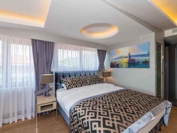 Feri Suites : photo 3 de la chambre chambre lit king-size deluxe - vue sur mer - annexe
