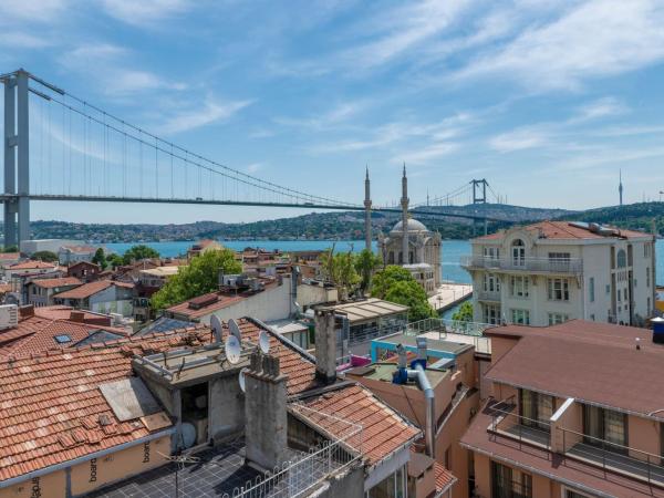 Feri Suites : photo 4 de la chambre chambre lit king-size deluxe - vue sur mer - annexe