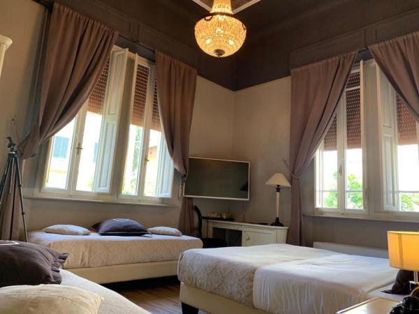 Villa Tower Inn : photo 9 de la chambre chambre familiale quadruple