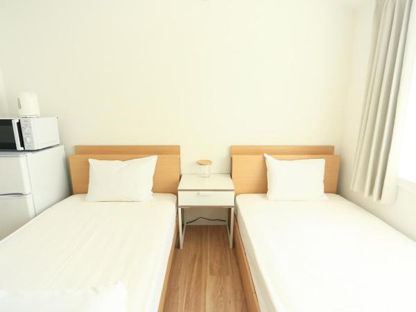 コインズホステル天神ペット宿泊可 : photo 1 de la chambre chambre lits jumeaux deluxe
