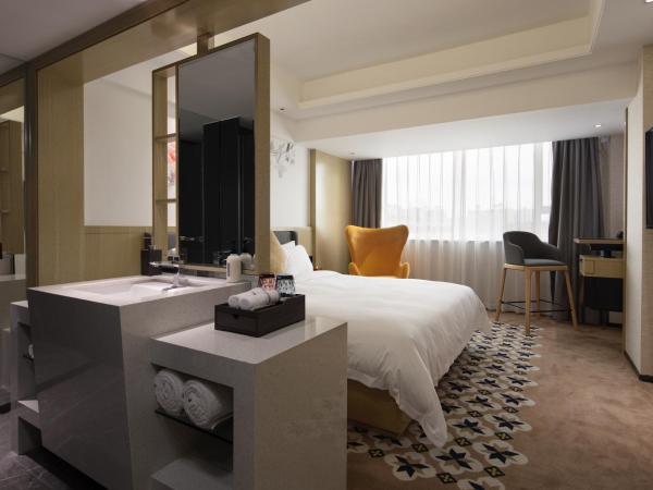 Paco Hotel Jiangtai Lu Metro Guangzhou ---Free Shuttle Bus For CantonFair : photo 1 de la chambre executive kingbed room
